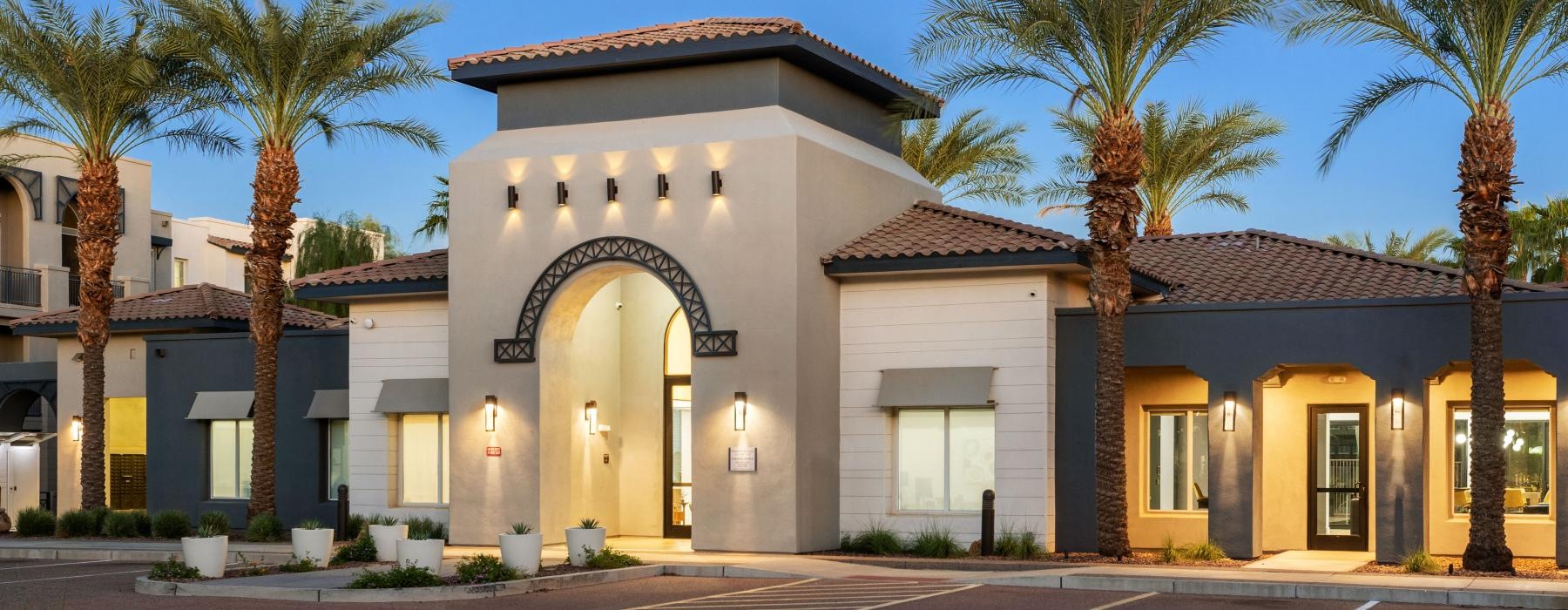 a building with palm trees in front of it
