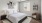 a bedroom with a bed and a fan