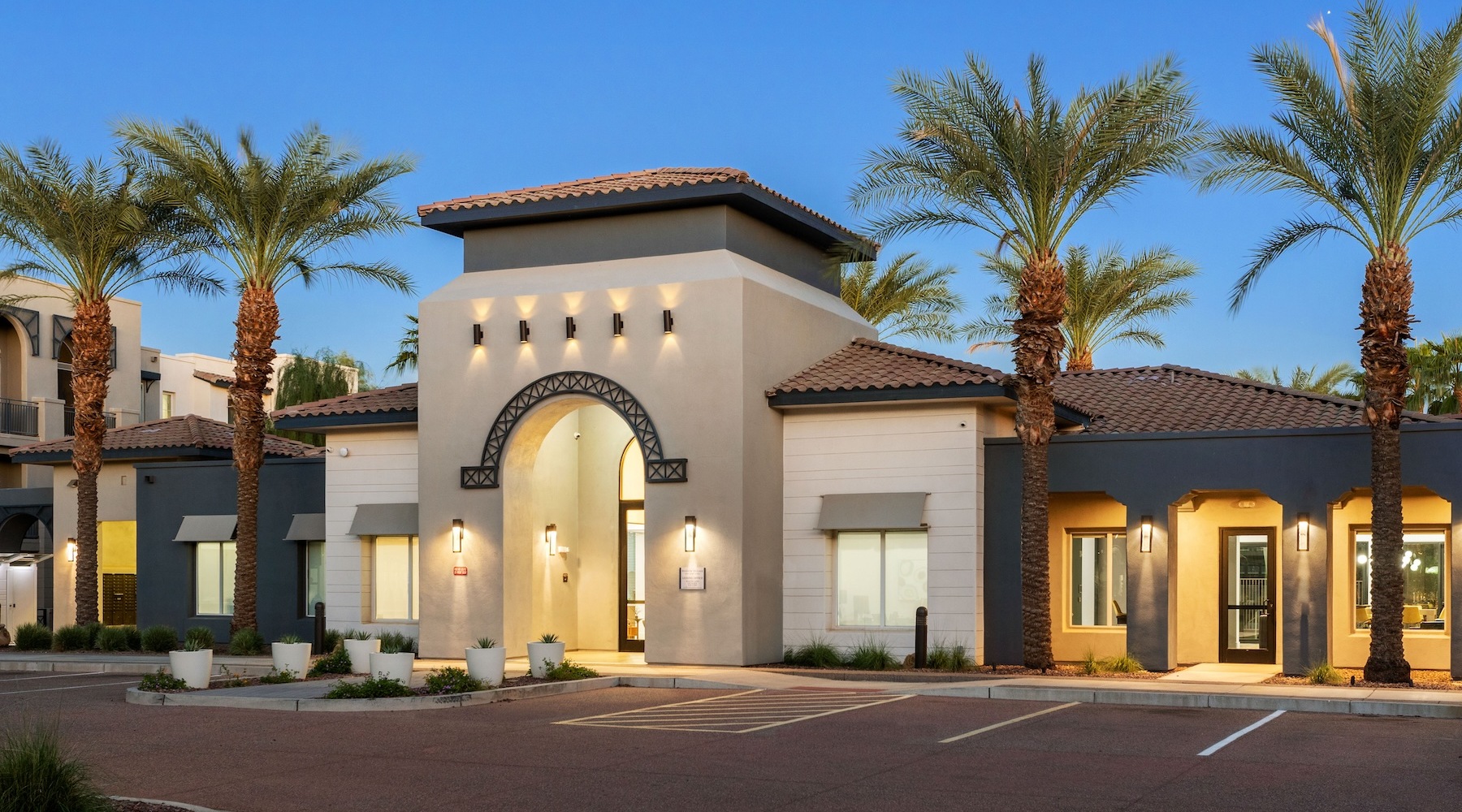 exterior of building showing the property's lush landscaping