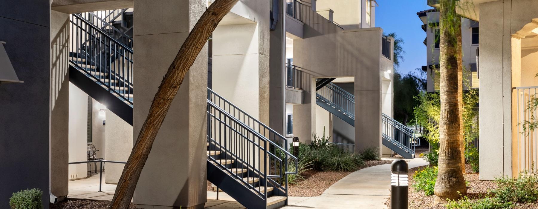 a building with stairs and trees