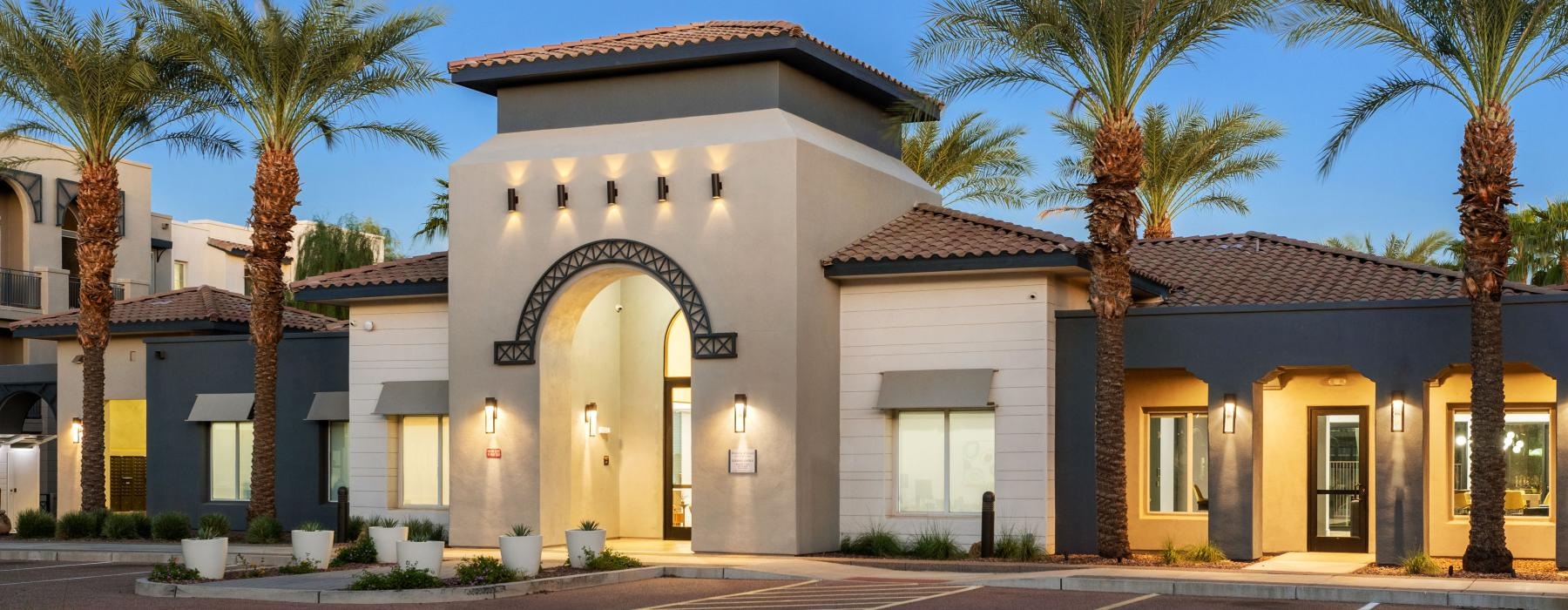 a building with palm trees in front of it